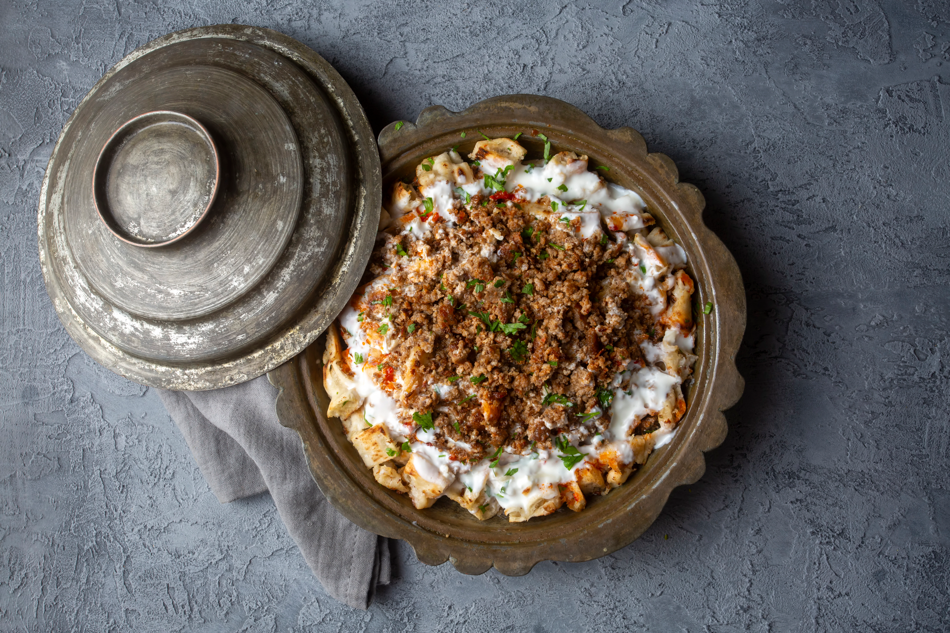 Crispy Palestinian Maqluba with Spiced Lamb and Pine Nut Garnish