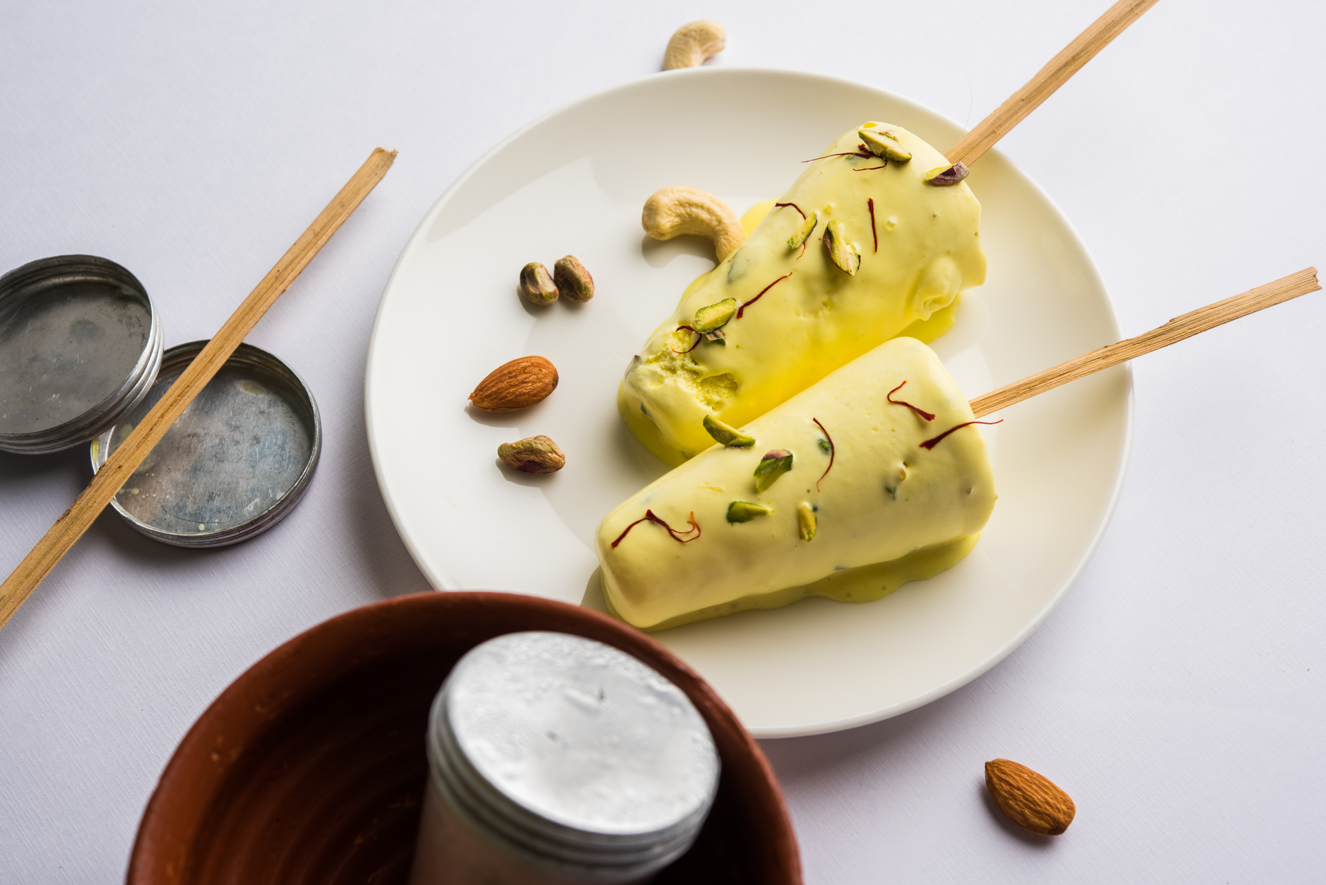 Floral Indian Cardamom Kulfi with Roasted Almond Topping