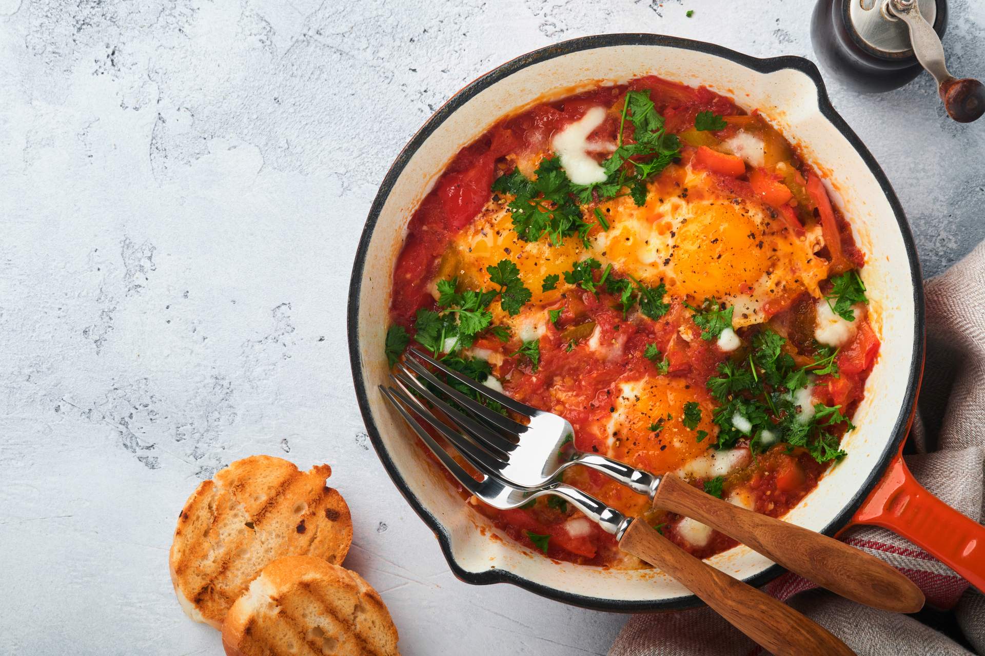 Israeli Shakshuka with Poached Eggs and Spicy Tomato Sauce