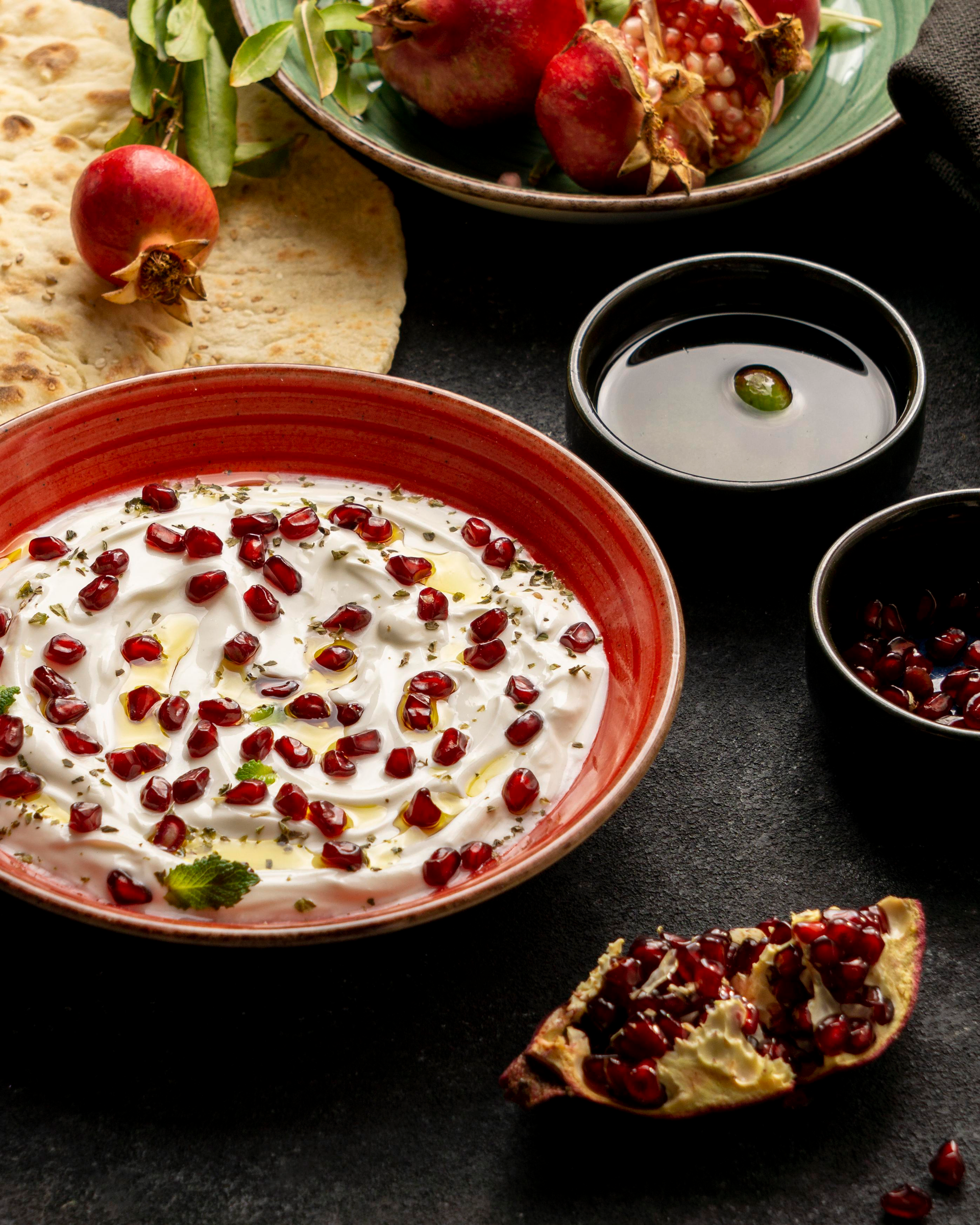Radiant Indian Raita with Pomegranate Seeds and Mint Leaves