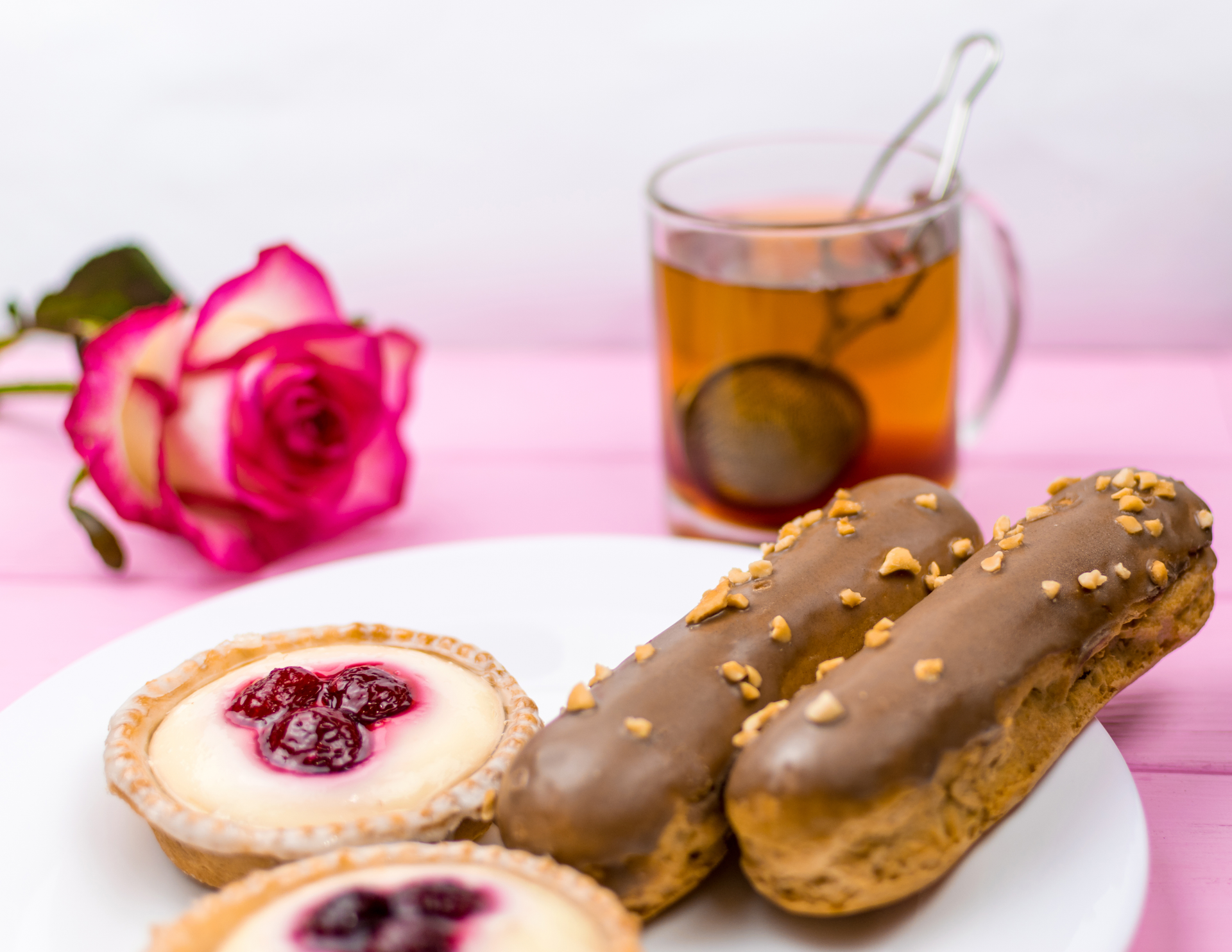 Rich Belgian Chocolate Éclair with Custard and Raspberry Compote