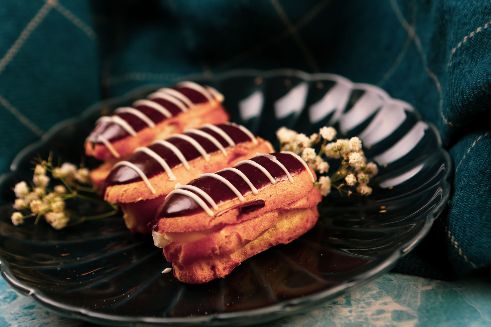 Rich Belgian Chocolate Éclair with Custard and Raspberry Compote