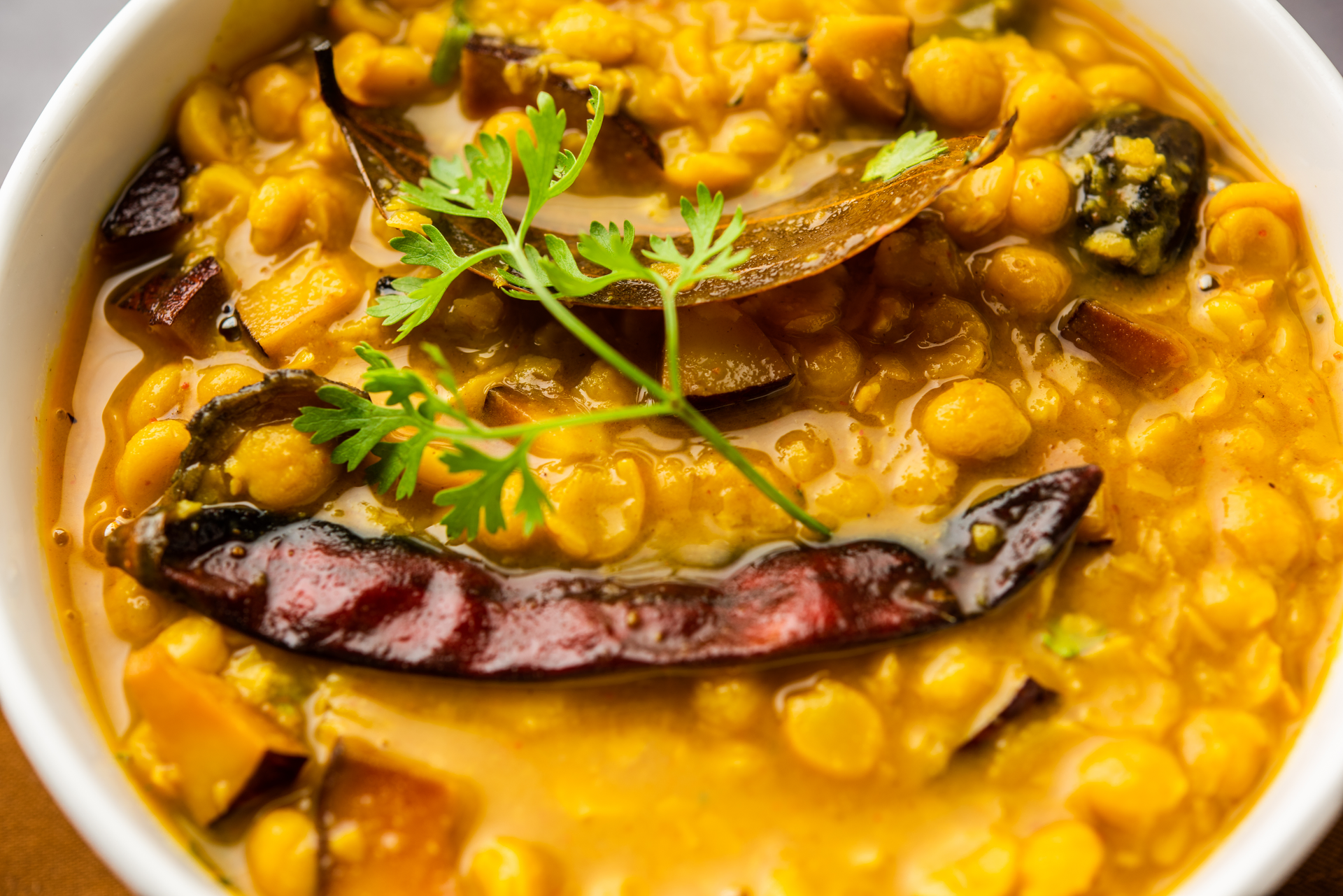 Saffron-Infused Catalan Escudella with Pork and Chickpeas