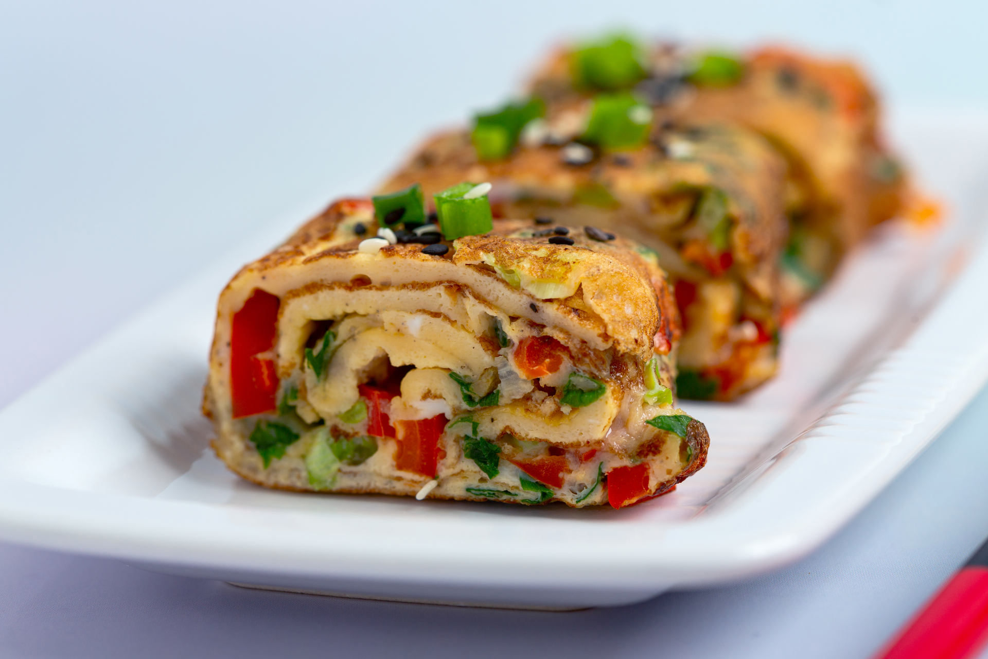 Savory Jamaican Ackee Roll-Ups with Saltfish and Scotch Bonnet Drizzle