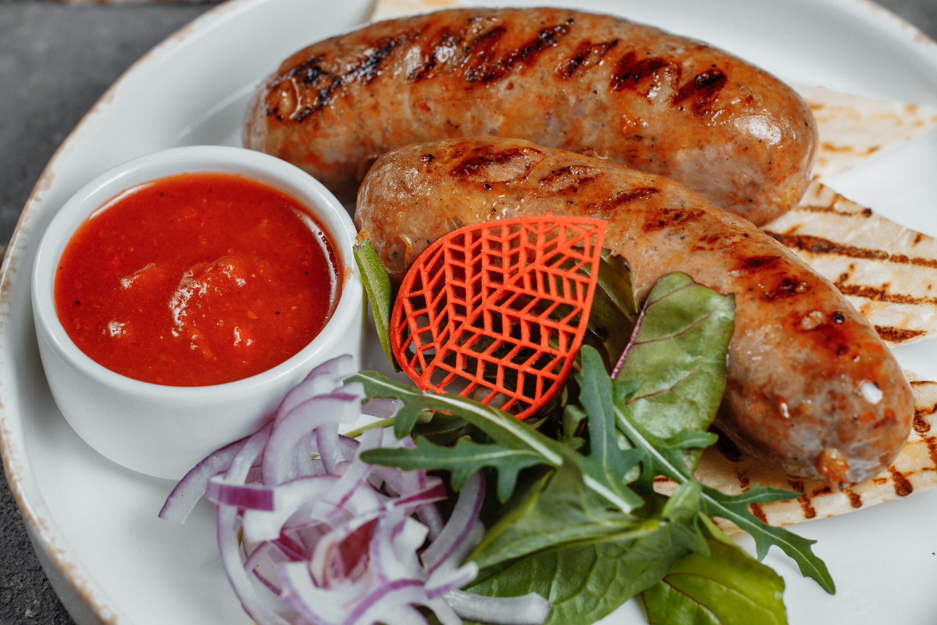 Spicy Algerian Merguez Sausage with Harissa Yogurt