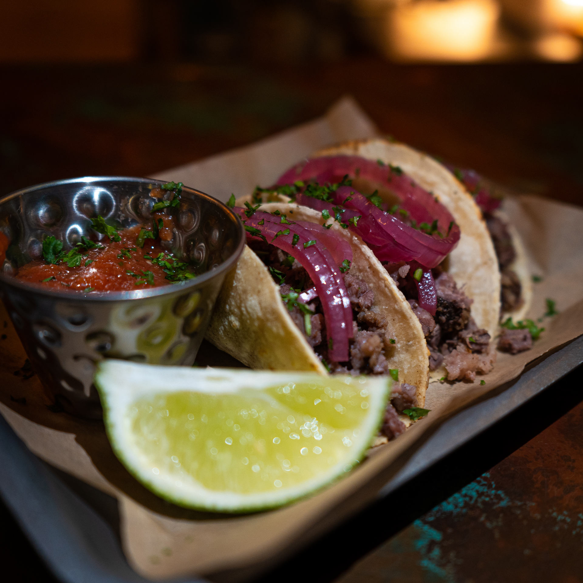 Spicy Brazilian Feijoada Tacos with Orange Pico de Gallo