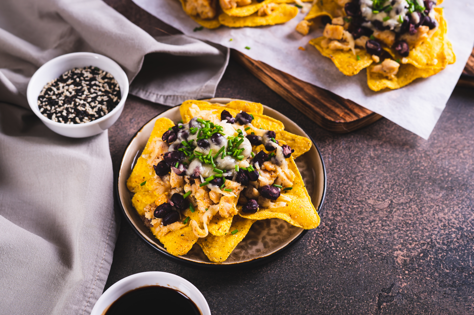 Zesty Brazilian Feijoada Nachos with Lime Crema